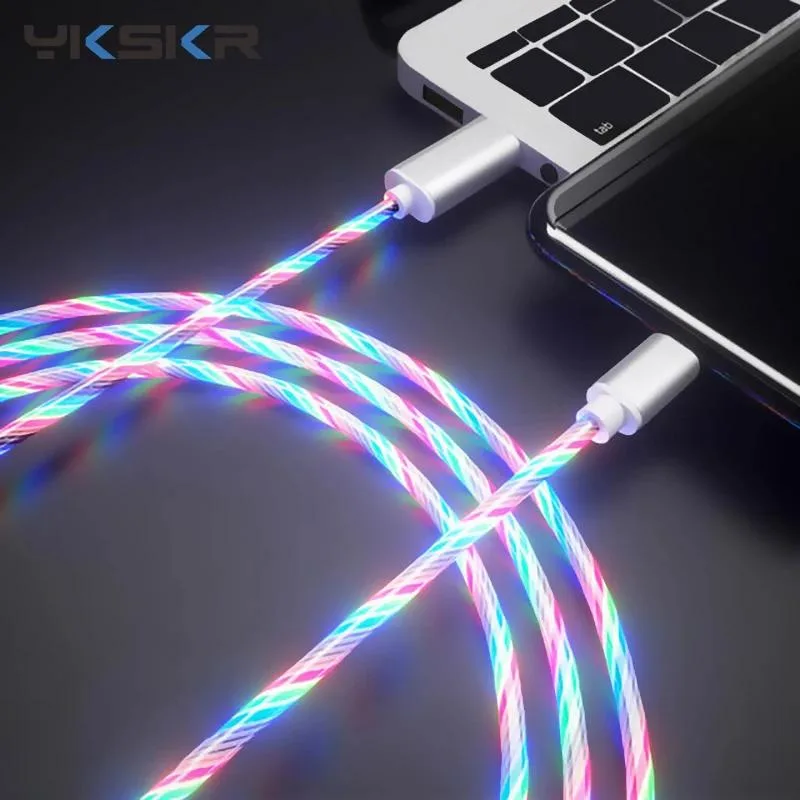 A coiled micro USB cable with glowing LED illumination along its length