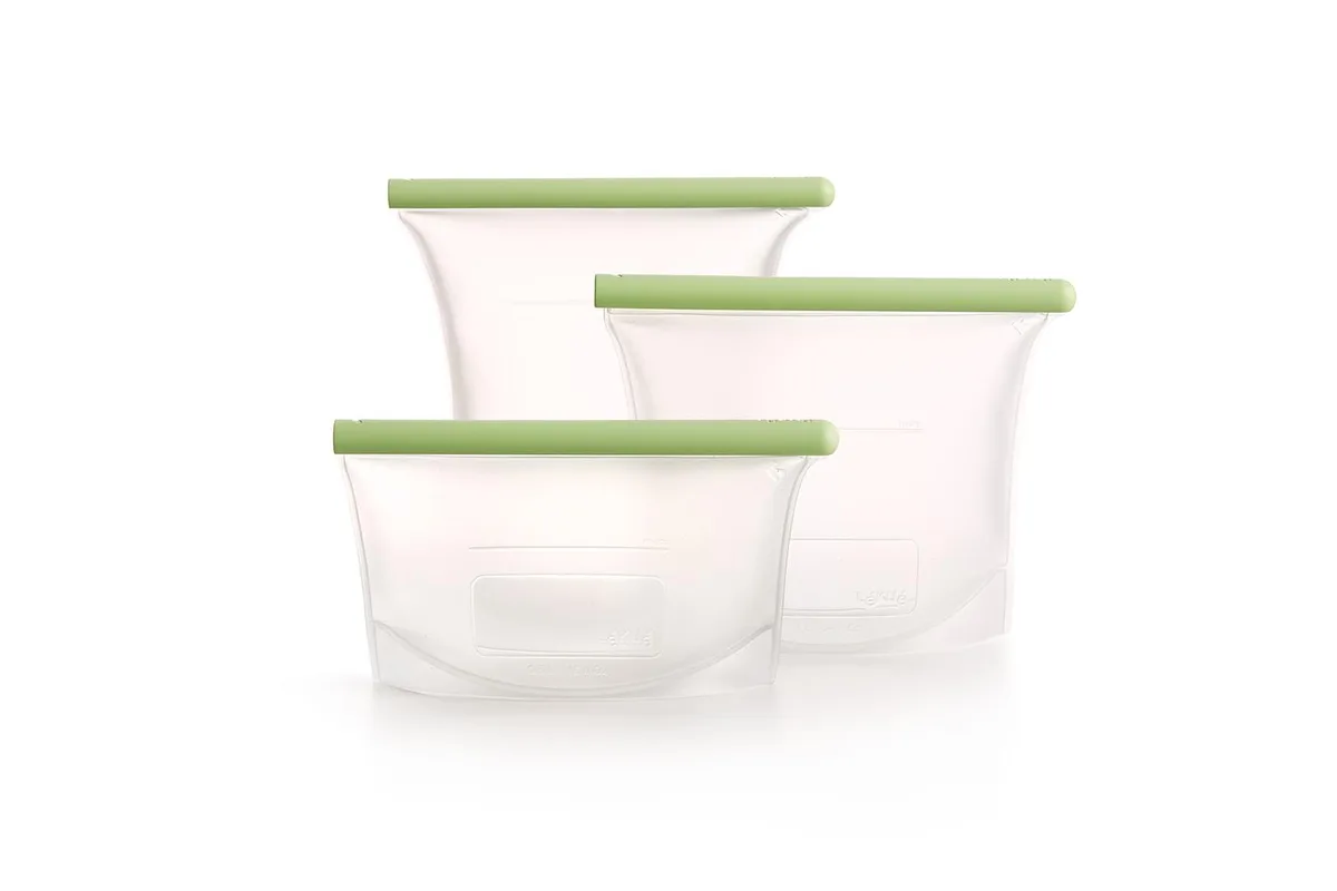 Three green platinum silicone reusable bags standing upright showing airtight seals and fill lines