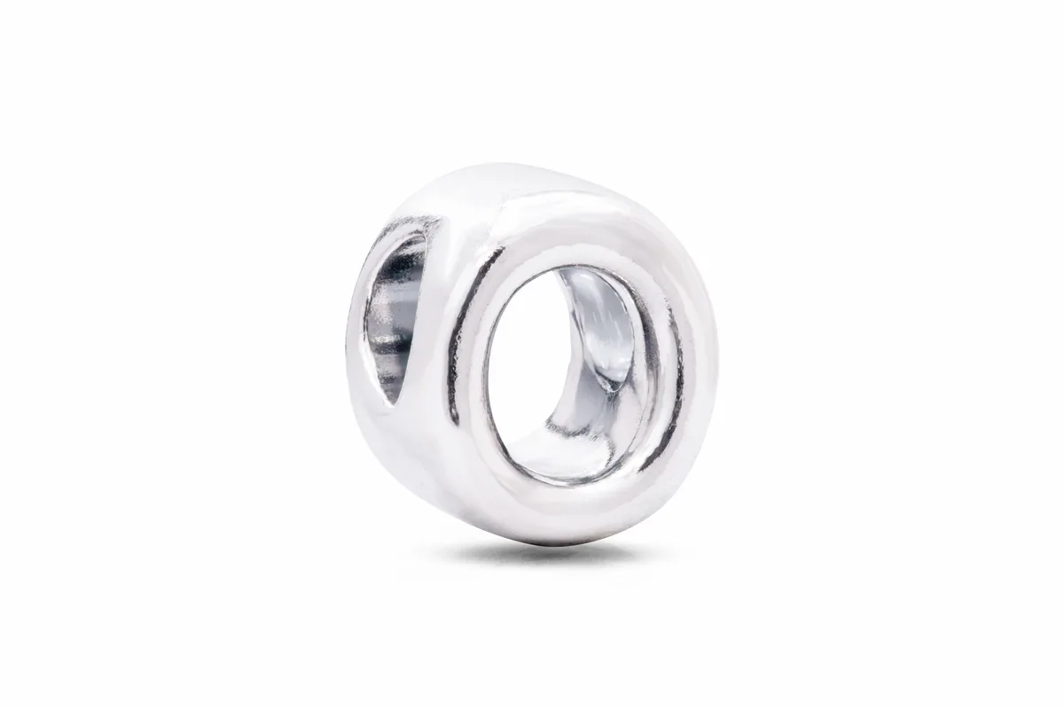 Sterling silver letter O charm with heart cut-out pattern