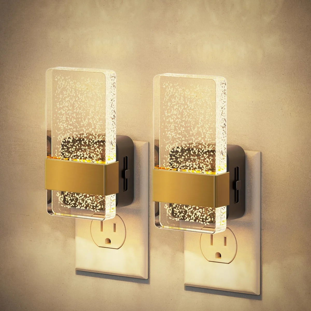 Two rectangular orange acrylic bubble night lights with wall plugs