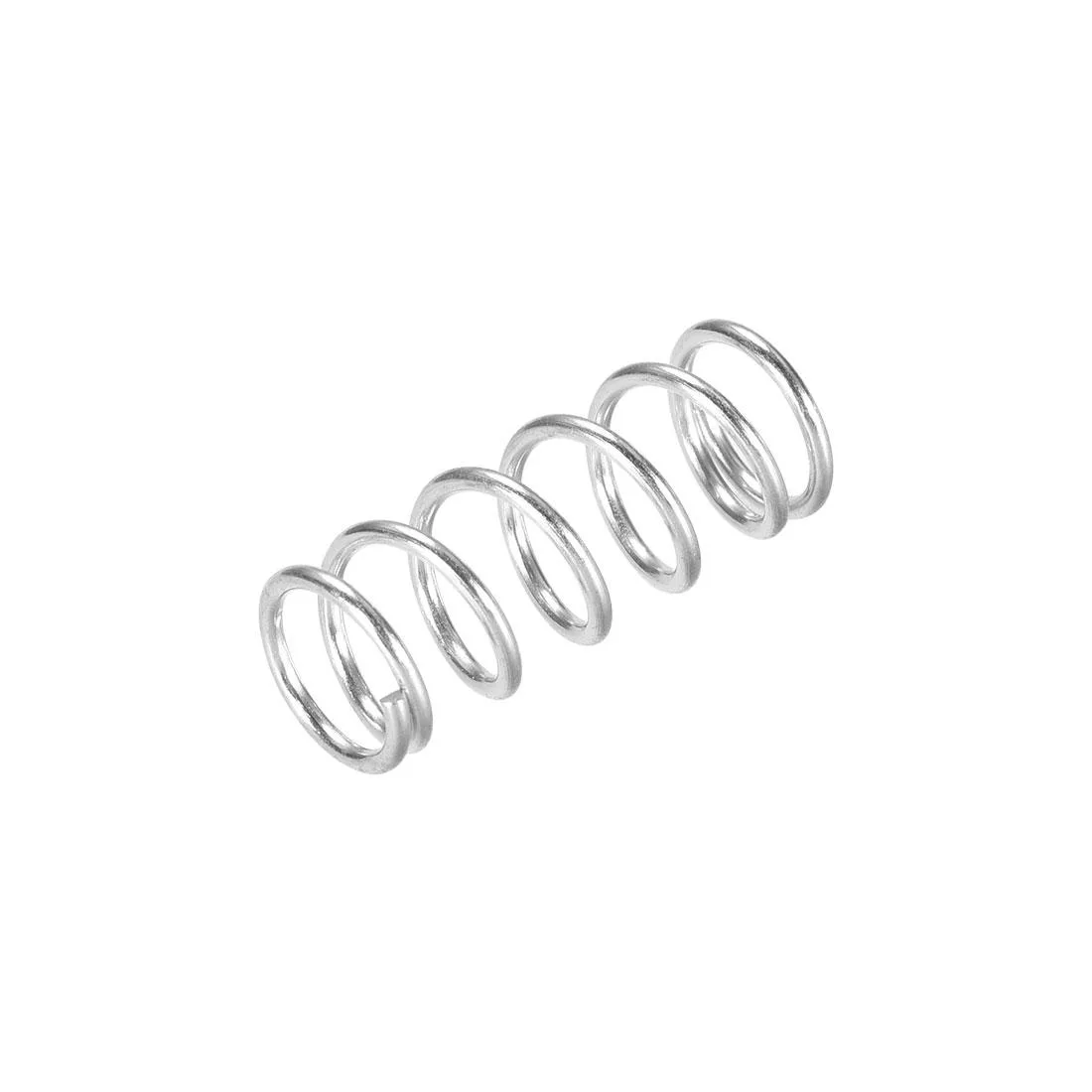 Twenty silver metal compression springs, 22 mm tall, 9 mm wide, in a pile