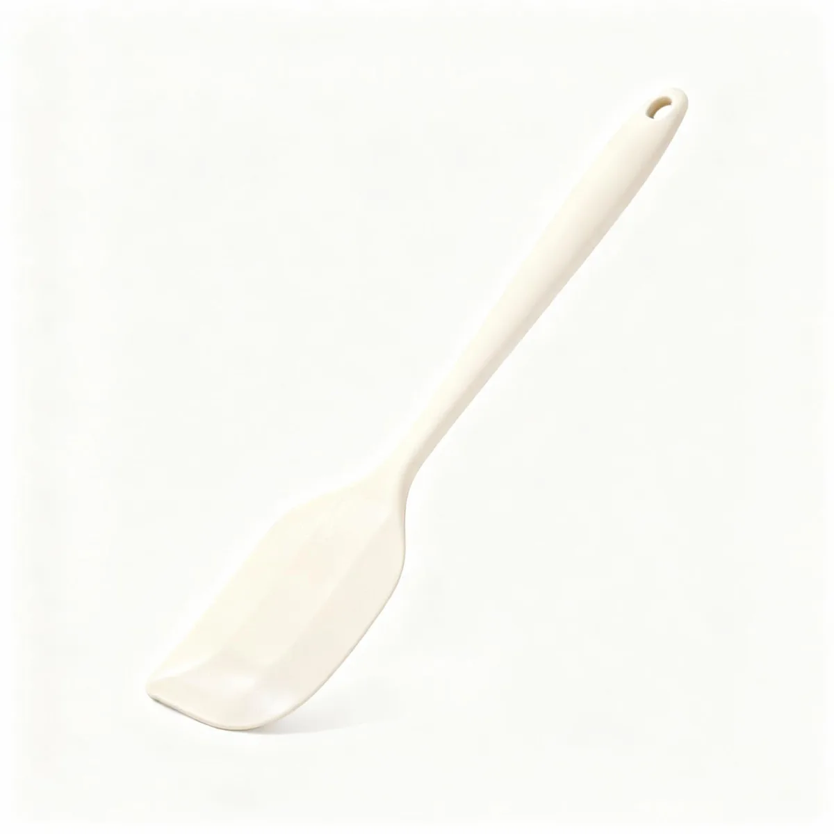 Black silicone spatula with rectangular head and ergonomic handle