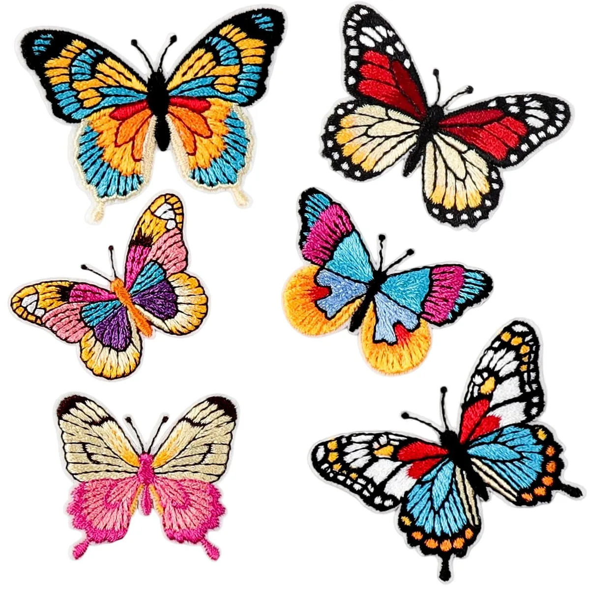 Six embroidered butterfly patches in assorted bright colours on a light background
