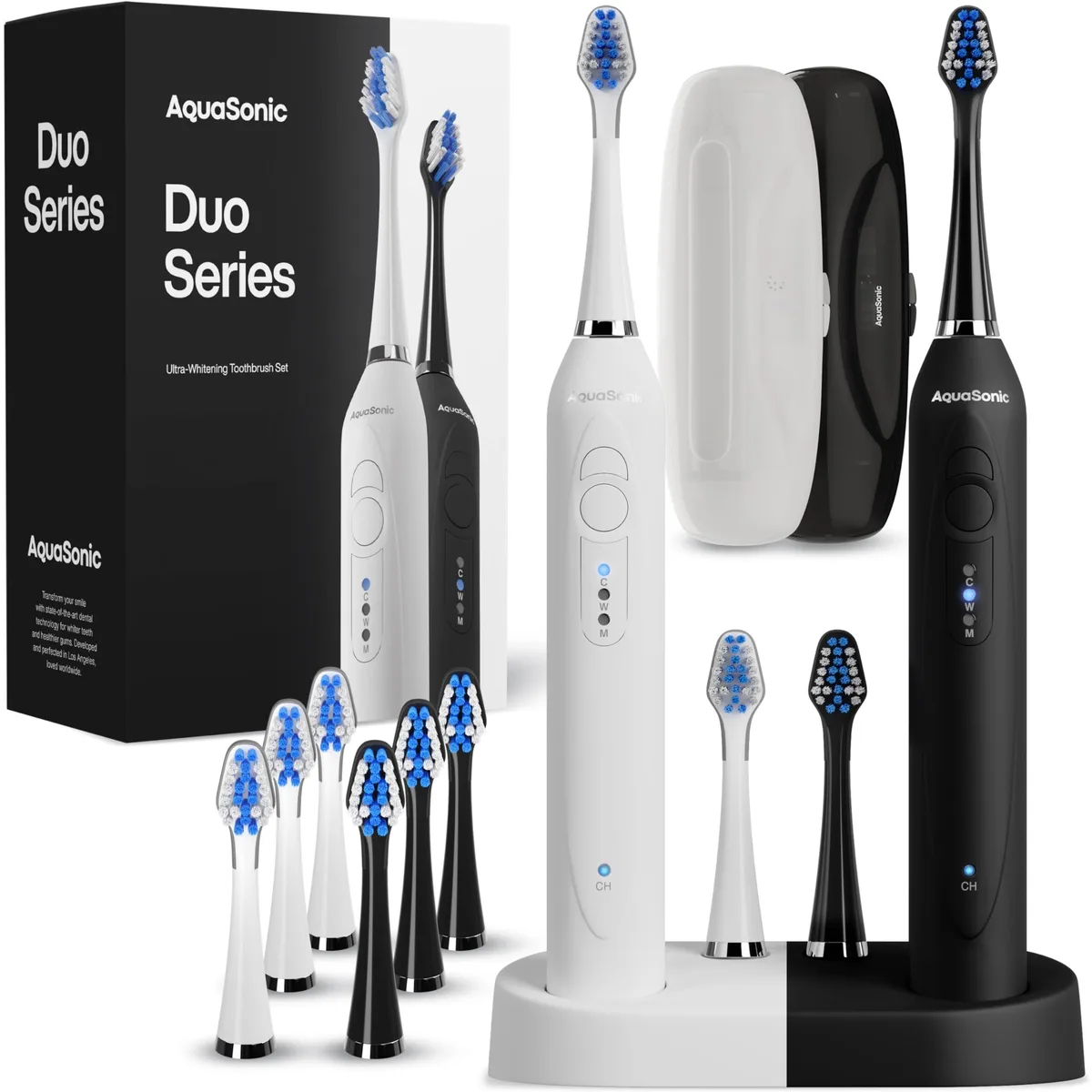Two black and white electric toothbrushes on a dual wireless charging dock with travel cases and brush heads