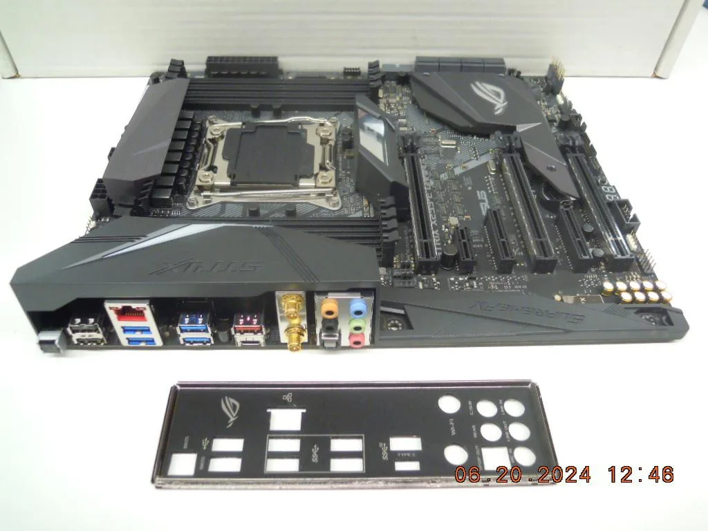ATX motherboard dark grey with silver heatsinks and RGB lighting