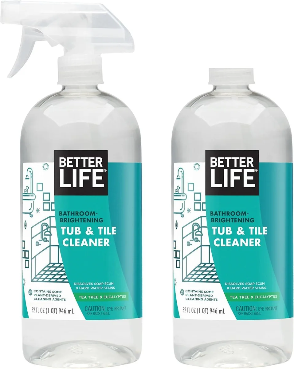 Two white 32oz spray bottles of plant-based bathroom cleaner with tea tree scent