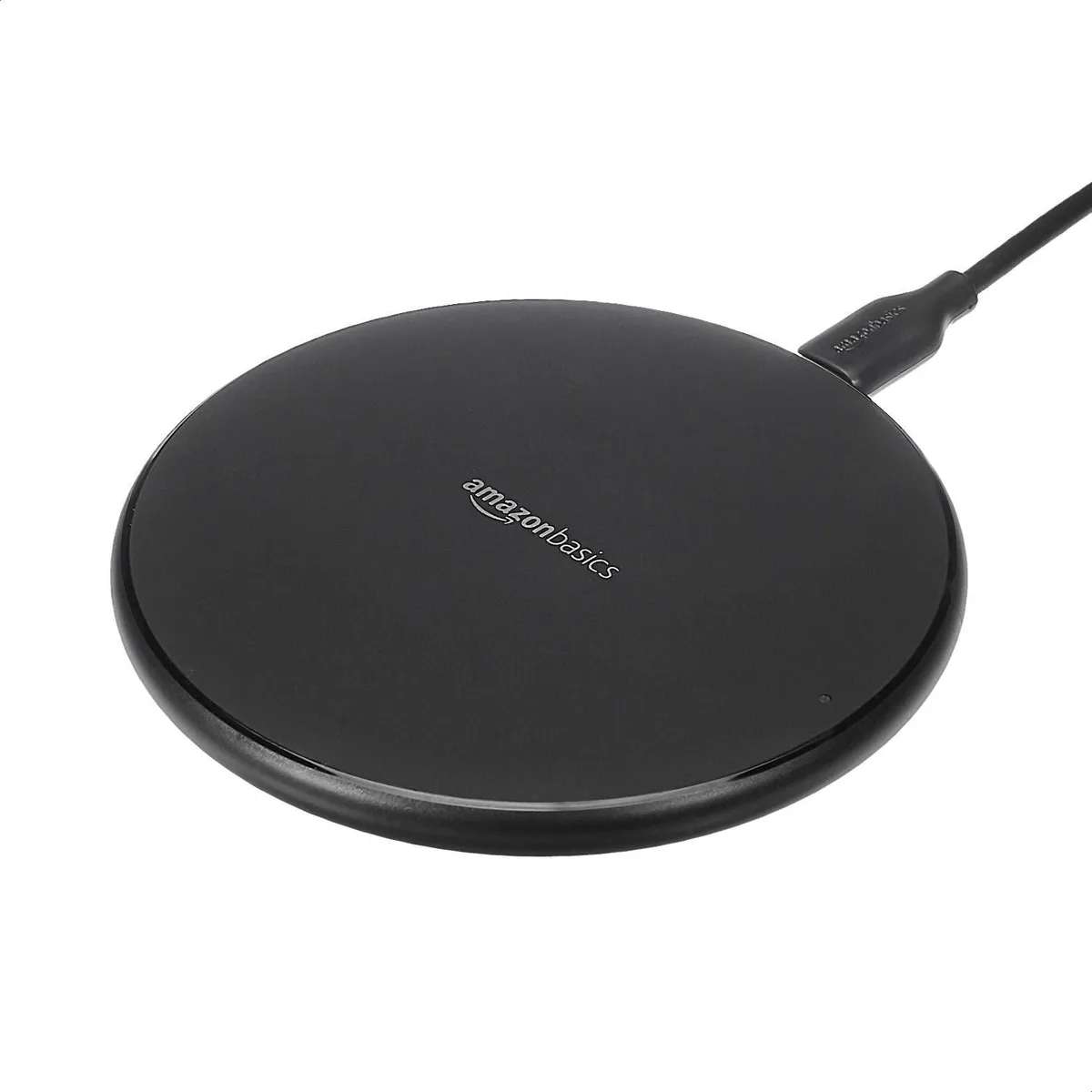 Black circular wireless charging pad with USB cable attached