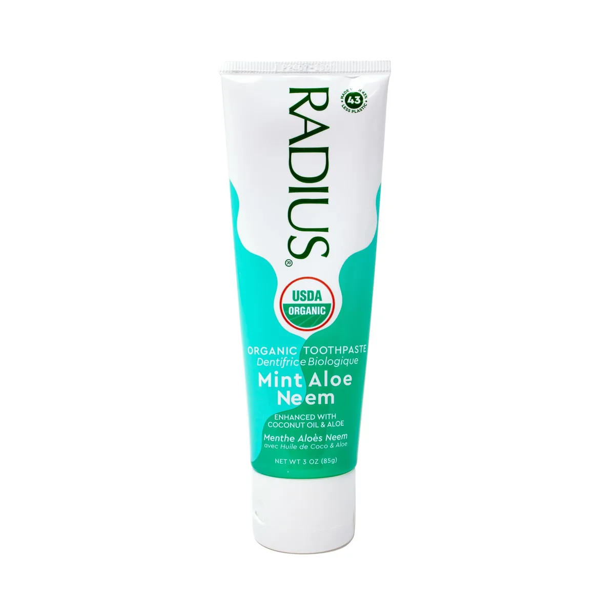 White squeeze tube with green flip cap, travel size toothpaste