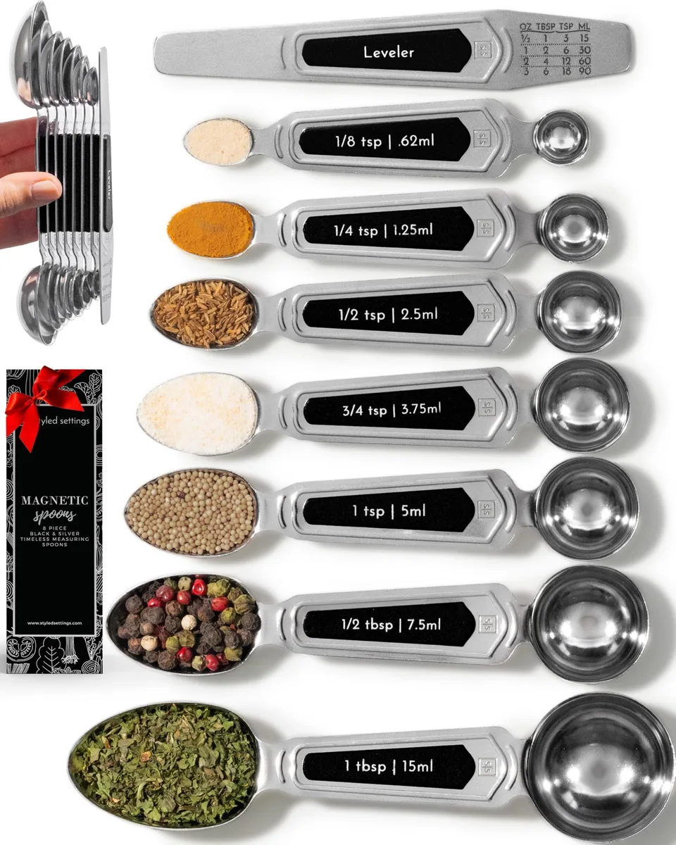 Eight stainless steel magnetic measuring spoons in nested stack, silver finish with narrow and round ends