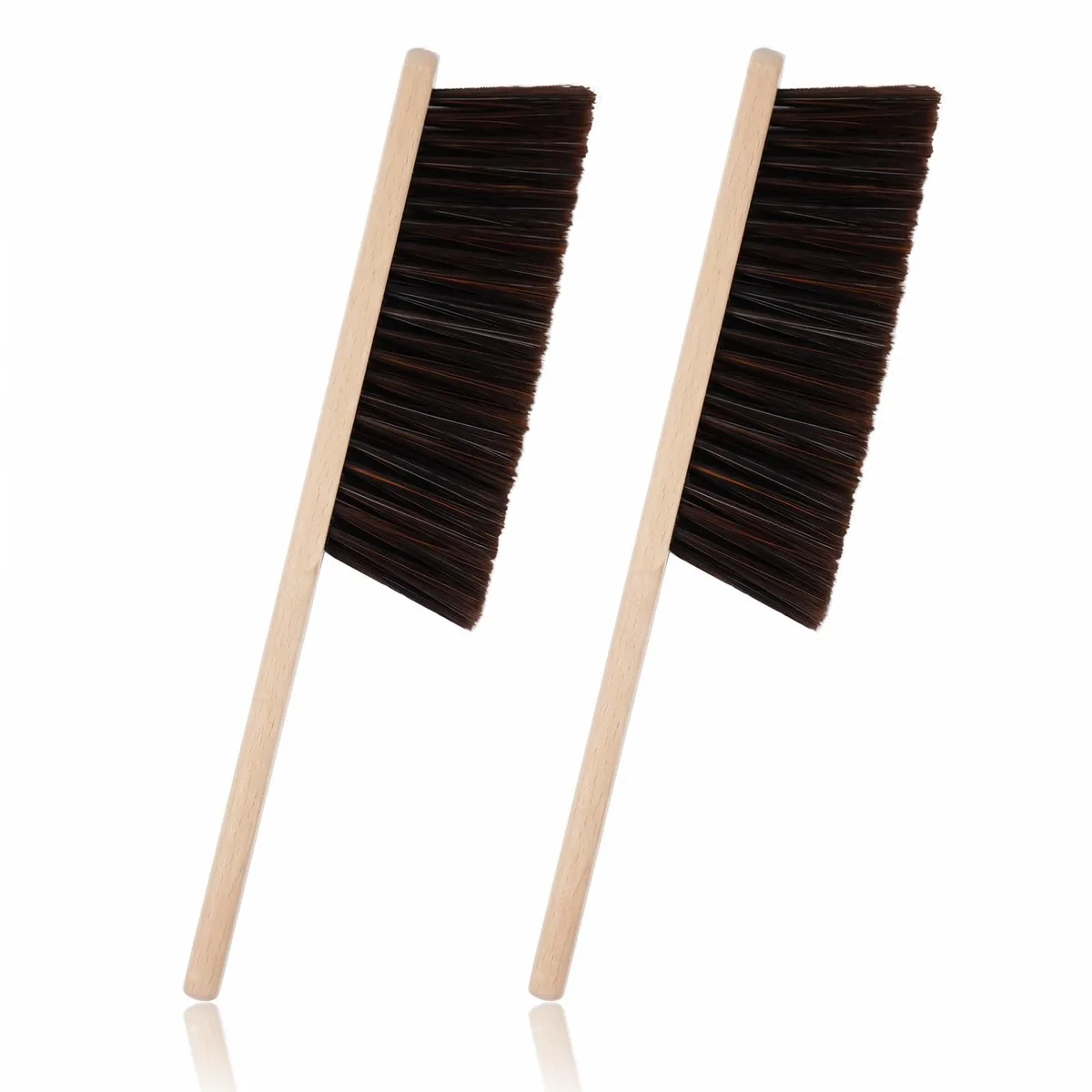 Two wooden-handled hand brooms with soft white bristles