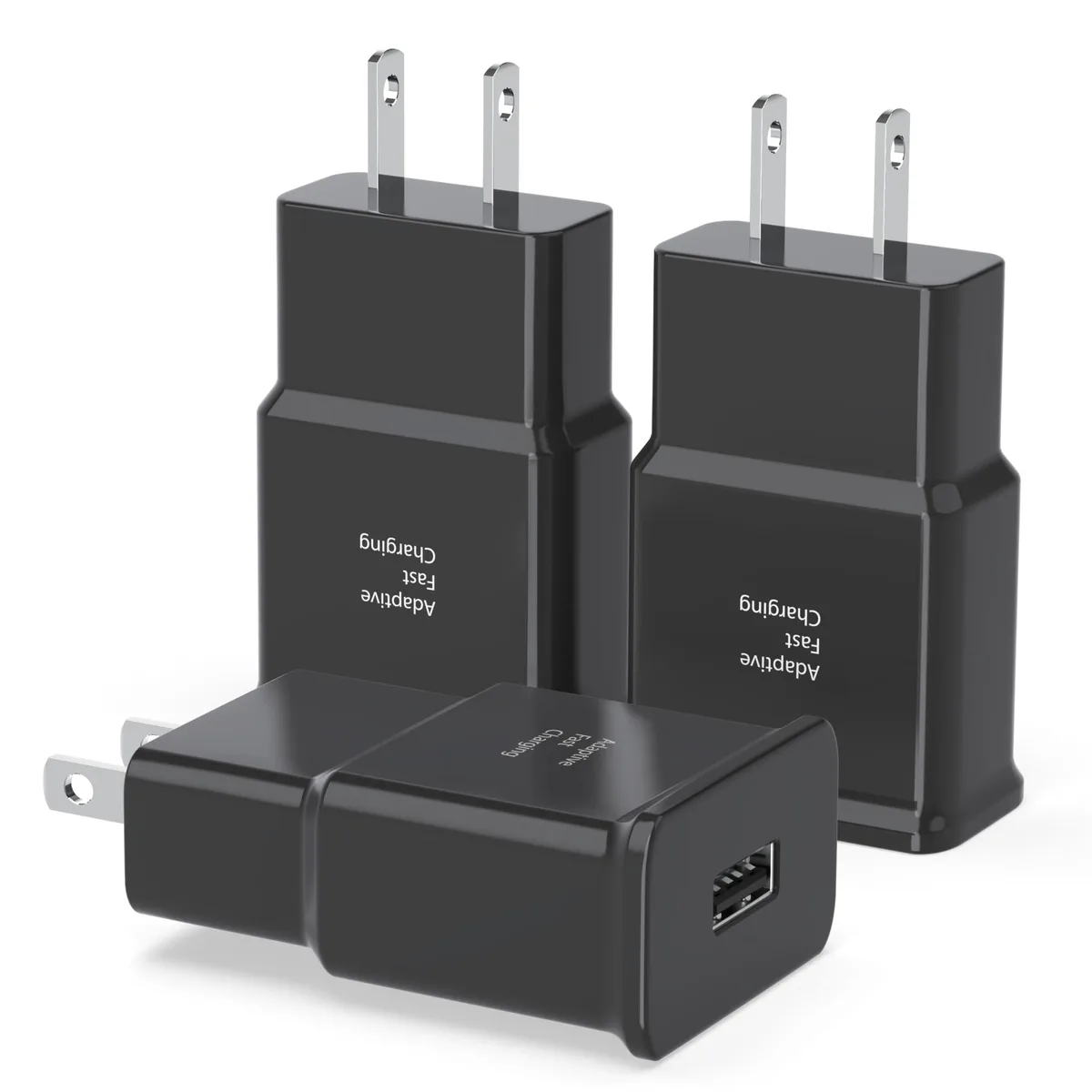 Three small white USB wall chargers side by side