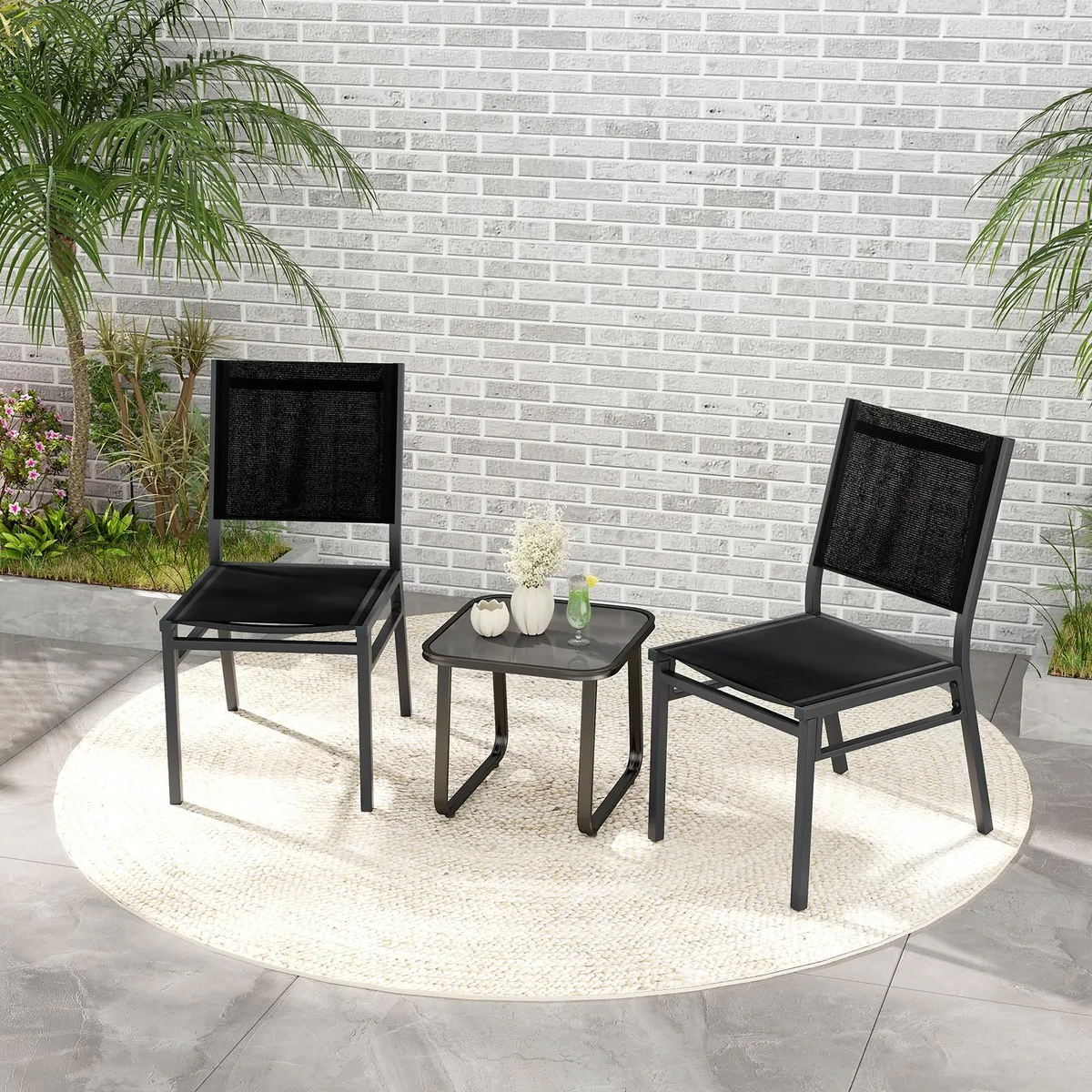 Black and grey outdoor dining chair with breathable fabric seat and metal frame