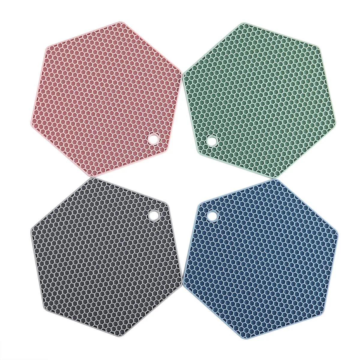 Four round silicone trivet mats in assorted colours, flexible and textured