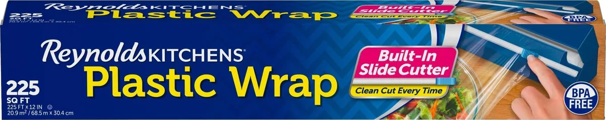 Cardboard box holding a clear plastic wrap roll with slide cutter
