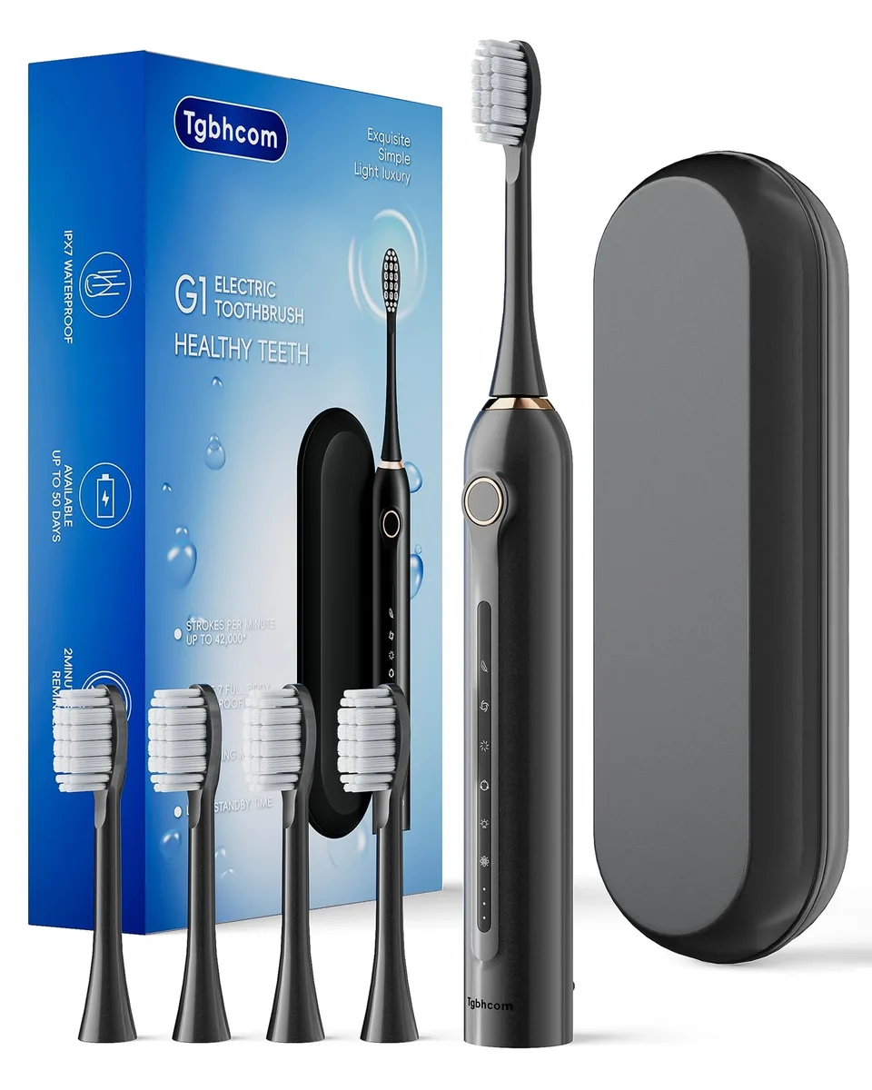 White electric toothbrush with travel case and four brush heads