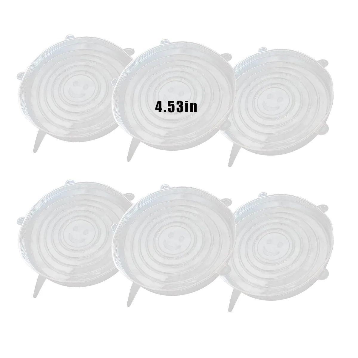 Six clear stretch silicone lids on a flat surface