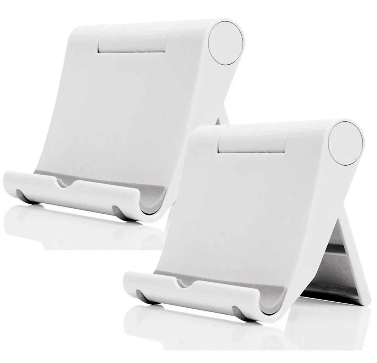 Two white foldable phone stands lying flat on a desk