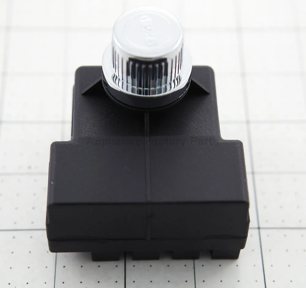 Small black electronic igniter module with connector wires