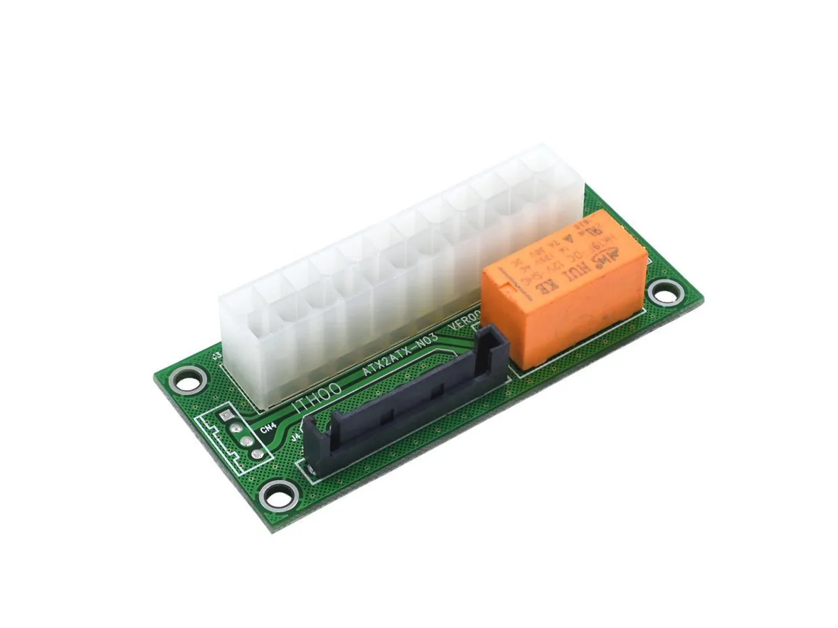Green circuit board with 24-pin ATX connector and SATA power socket