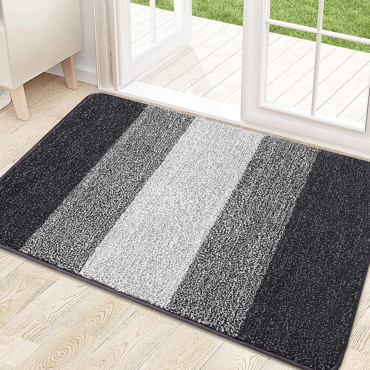 Grey braided low-profile doormat, 32 by 20 inches, .4 inch thick, flat on floor
