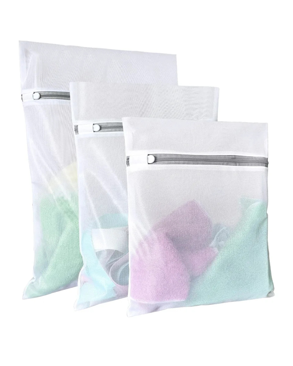 Three beige mesh laundry bags with zipper closures, sizes large medium small