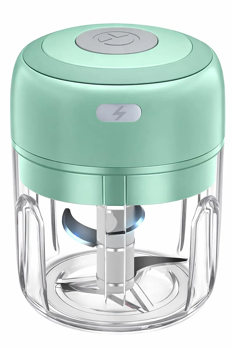 Small white electric food chopper with clear bowl and USB charging port