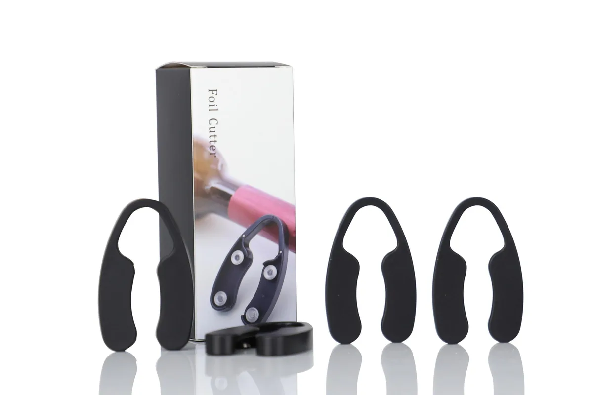 Four black foil cutters with magnetic backs and stainless blades