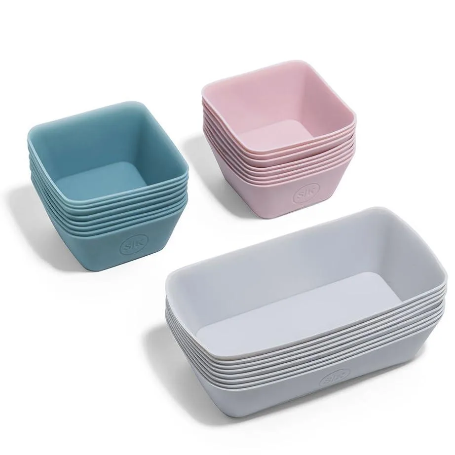 Set of 24 square and rectangular silicone cups in pink, blue and grey inside a cotton mesh bag