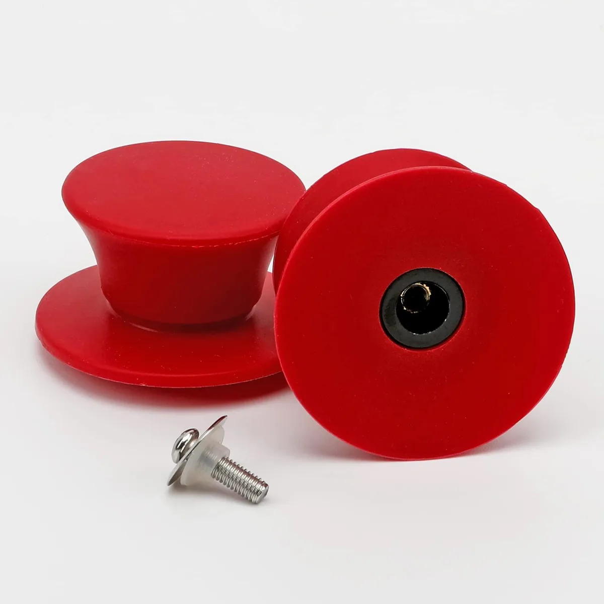Two red silicone pot lid knobs with mounting hardware