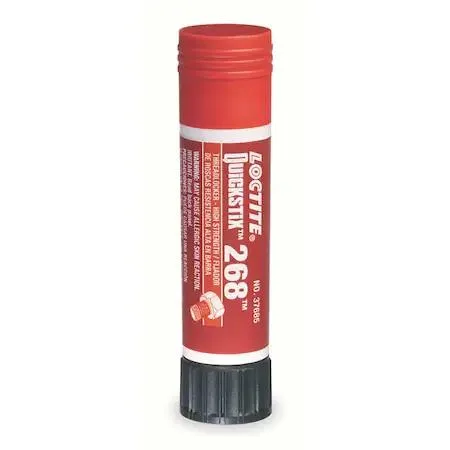 Red solid threadlocker stick in a small cylindrical container