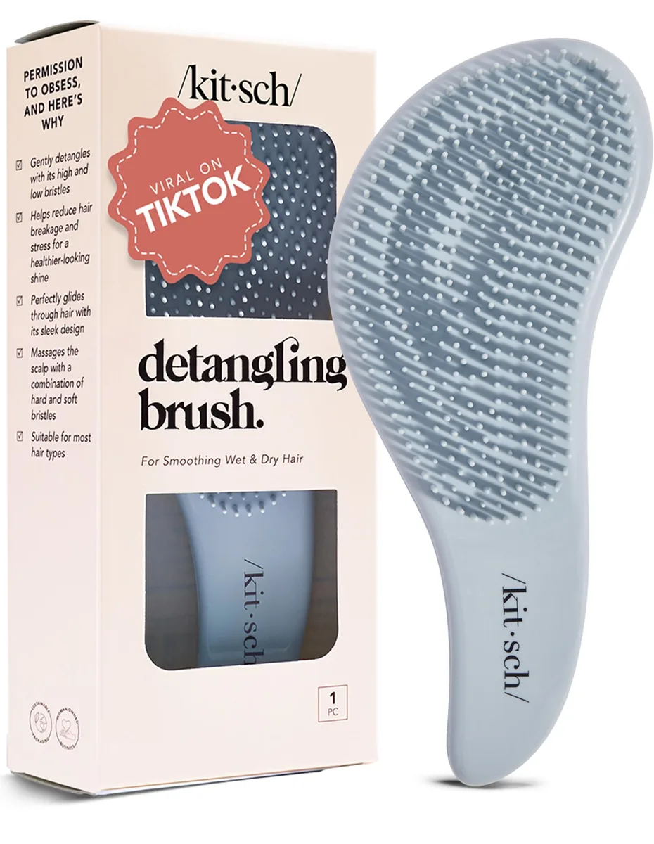 Oblong Haze Blue detangler brush with flexible nylon bristles and rubber handle