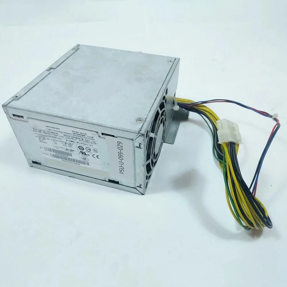 Rectangular ATX power supply unit, metal casing, fan grille visible, label with model number