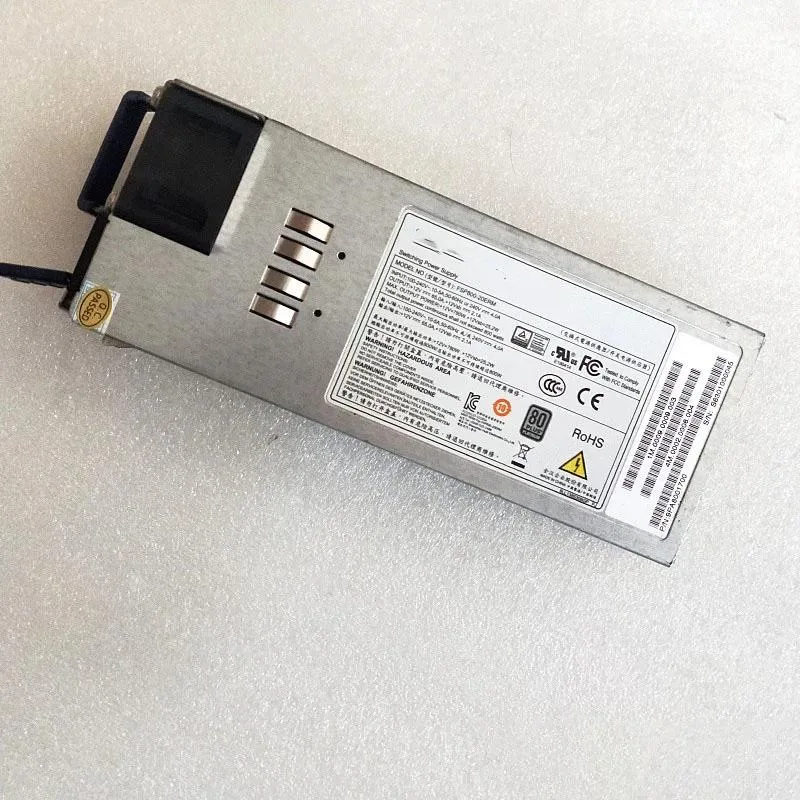 Rectangular silver server power supply unit with rear fan grille and power connector