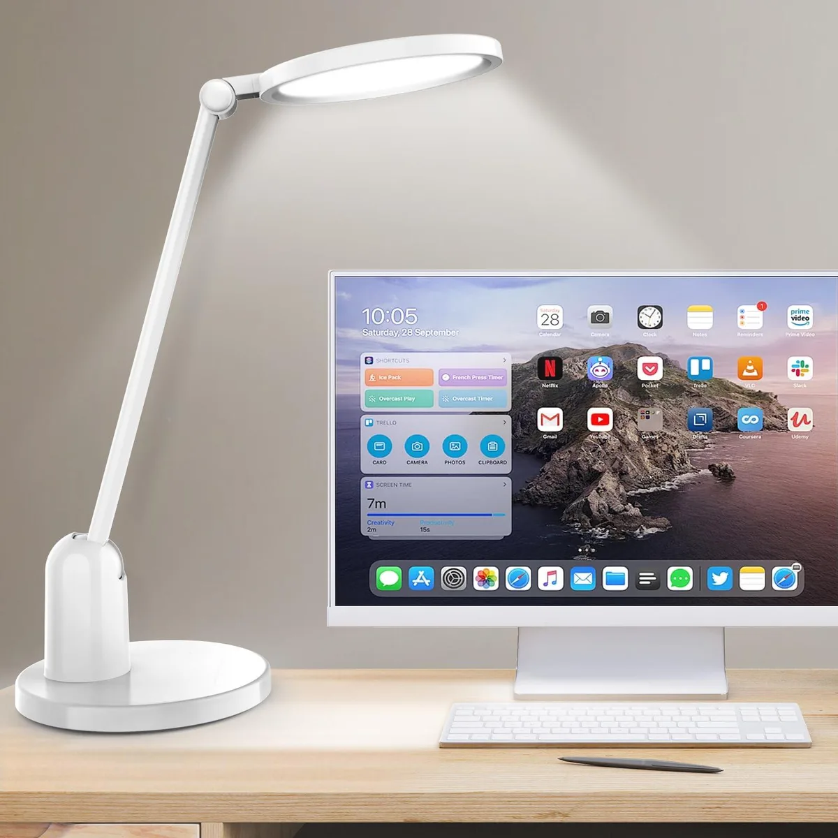White table lamp with wide round light head and heavy round base