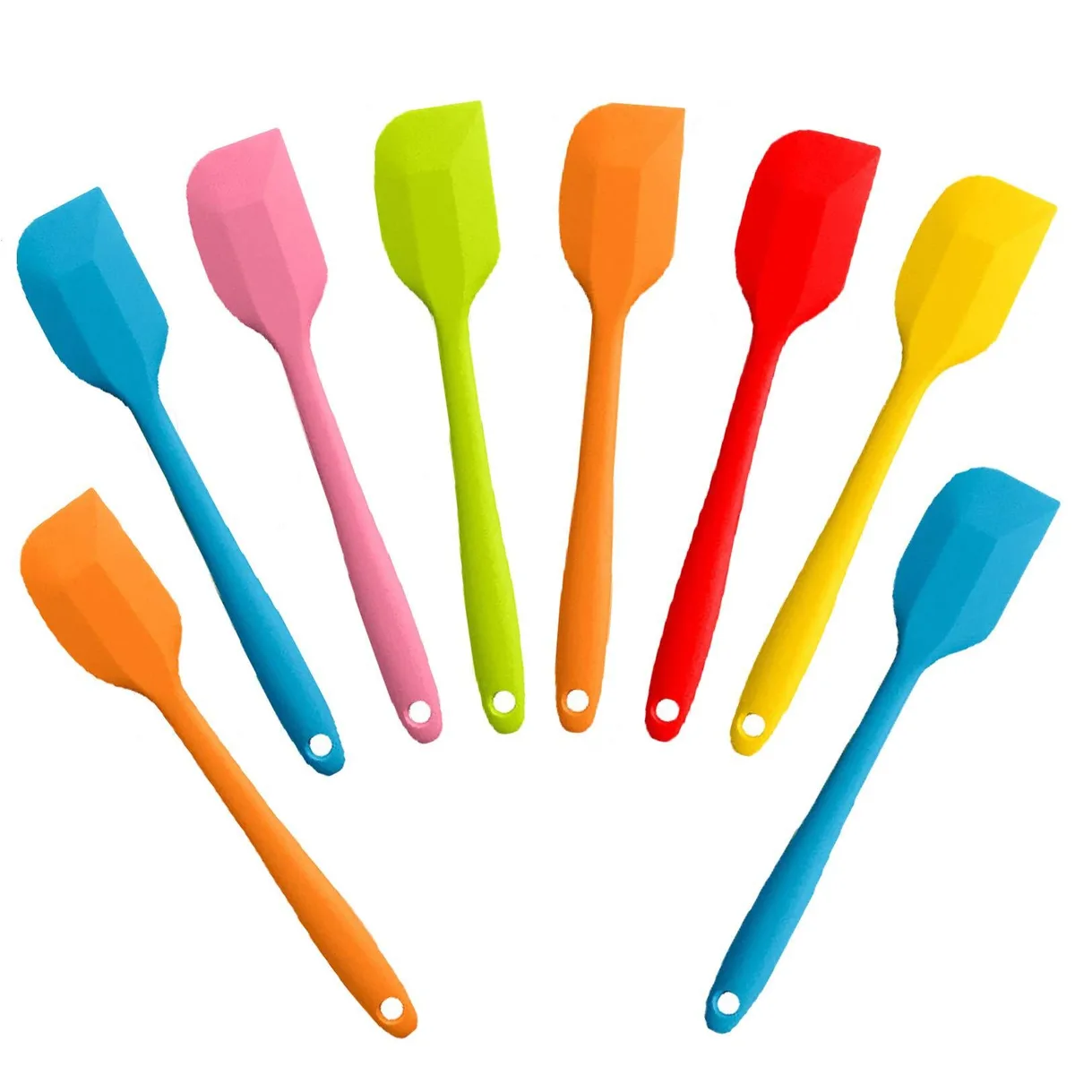 Eight multicoloured silicone spatulas with stainless steel cores lying together
