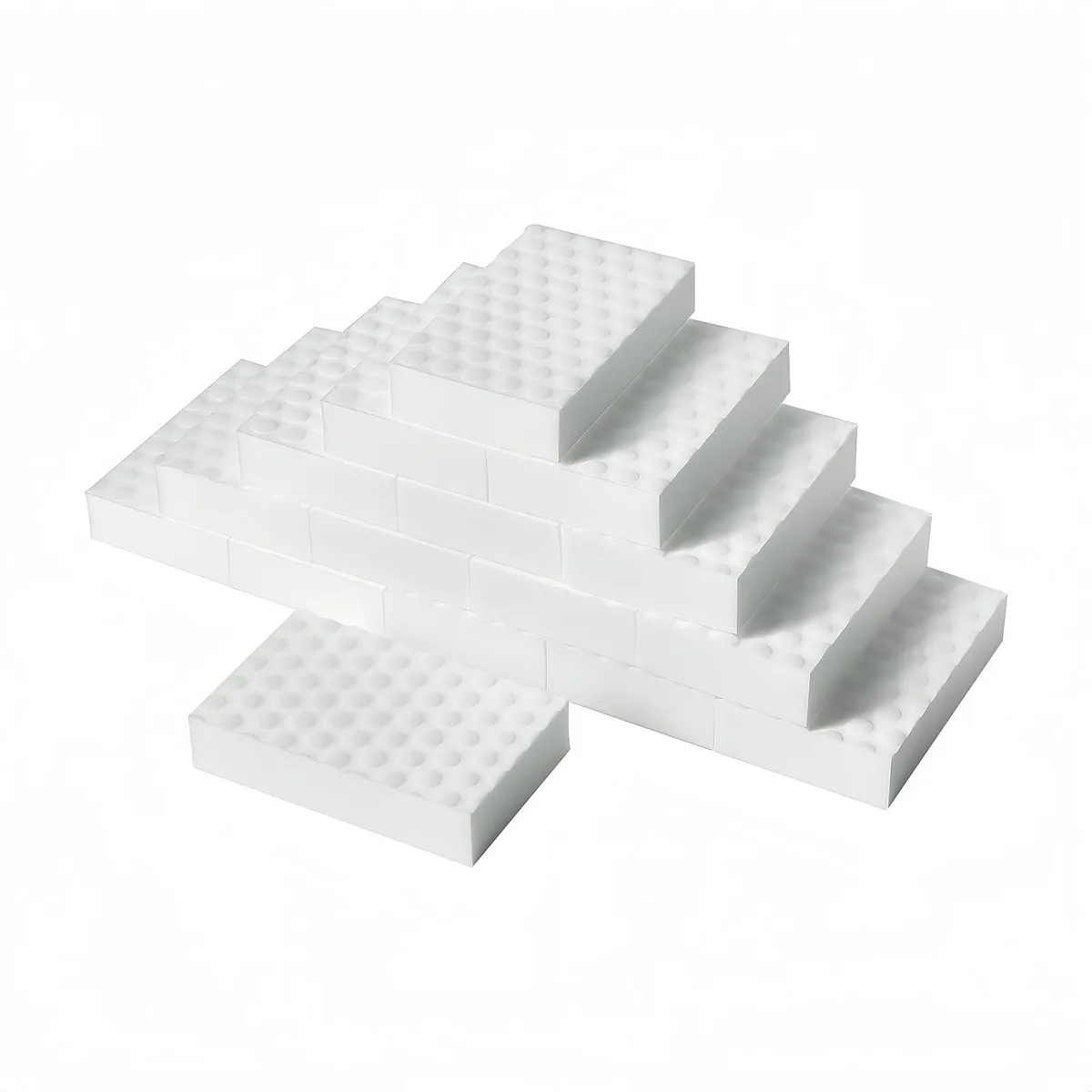 Twenty white rectangular melamine foam blocks, each about four by two inches