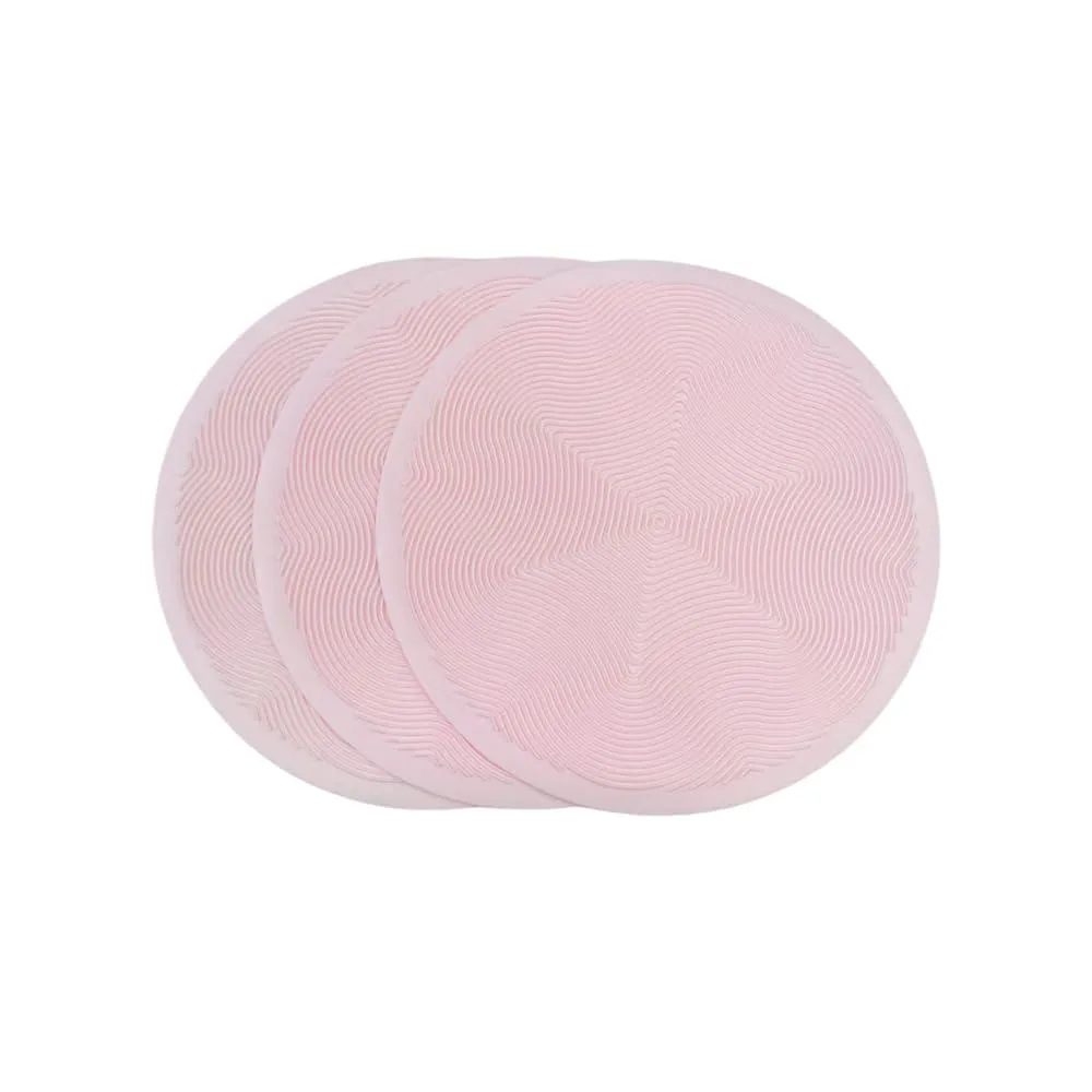 Three medium pink silicone mats with raised geometric pattern, 10in diameter