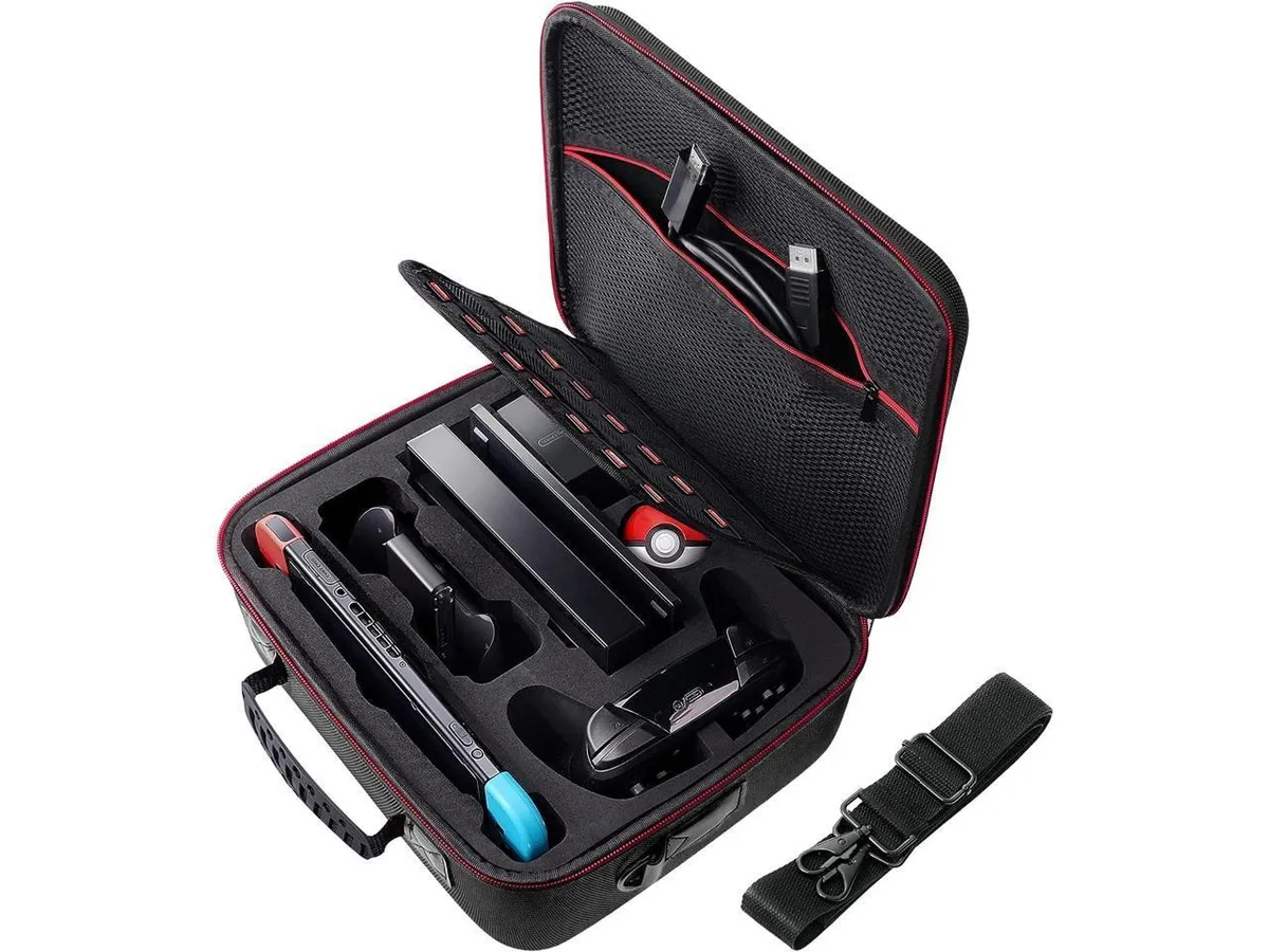 Black hard-shell carrying case with handle and shoulder strap, foam-lined interior for Switch console and 21 game cards
