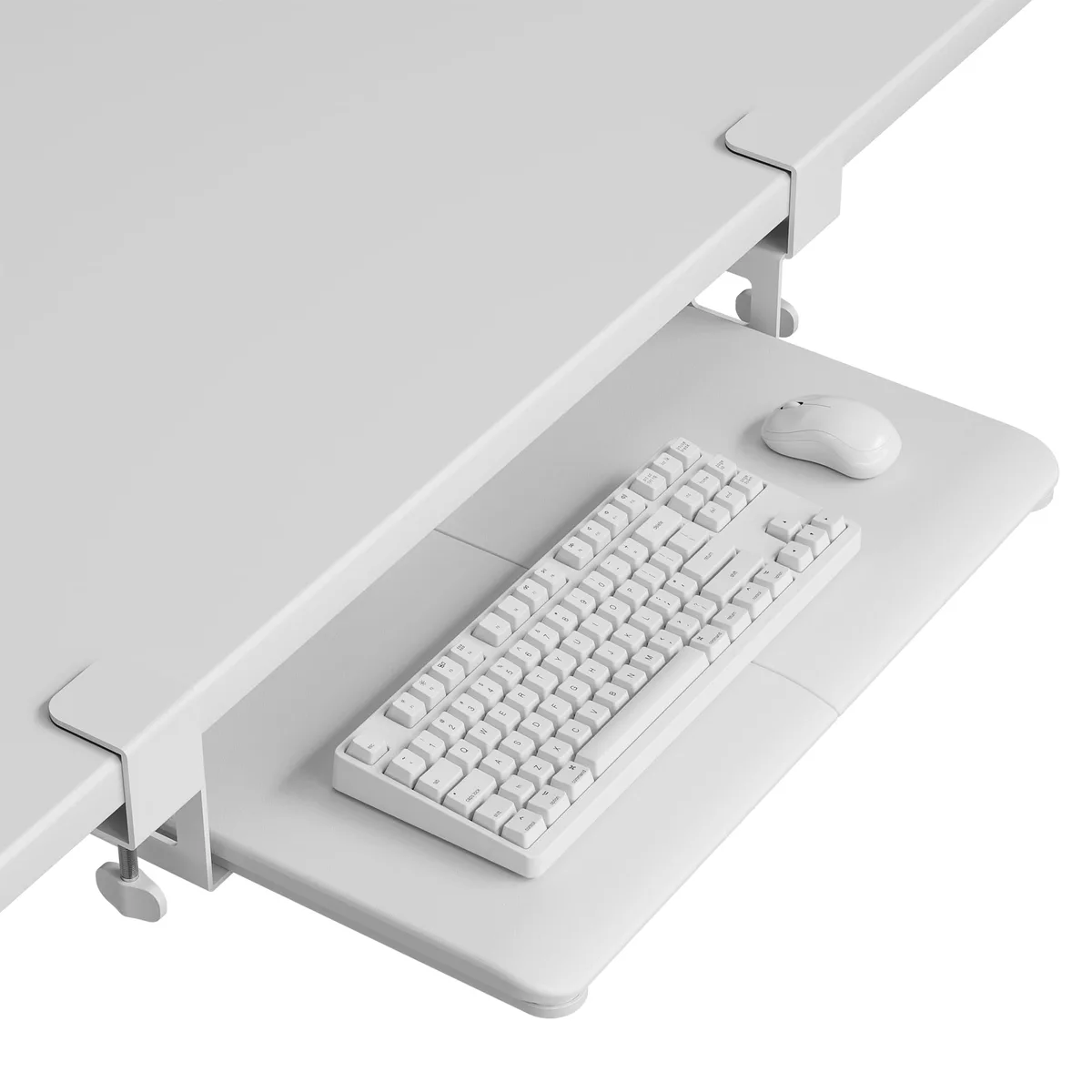 White rectangular keyboard tray on sliding rails with black C-clamps and textured MDF surface