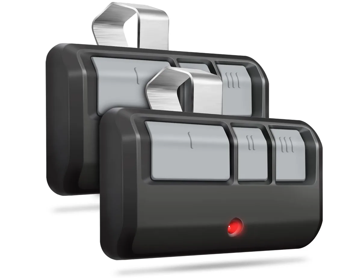 Two black three-button garage door opener remotes side by side