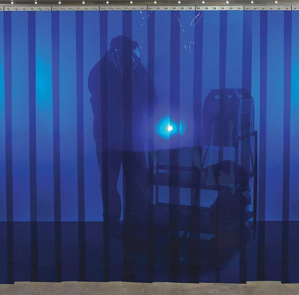 Transparent blue PVC welding strip curtain, 10 ft wide, 72 oz material with grommets