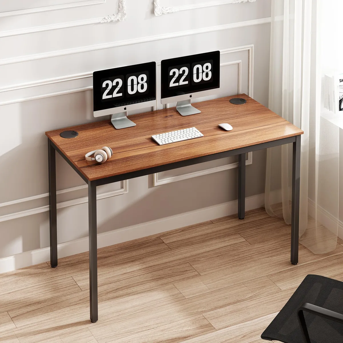 Red rectangular desk with black carbon steel frame and cable grommets