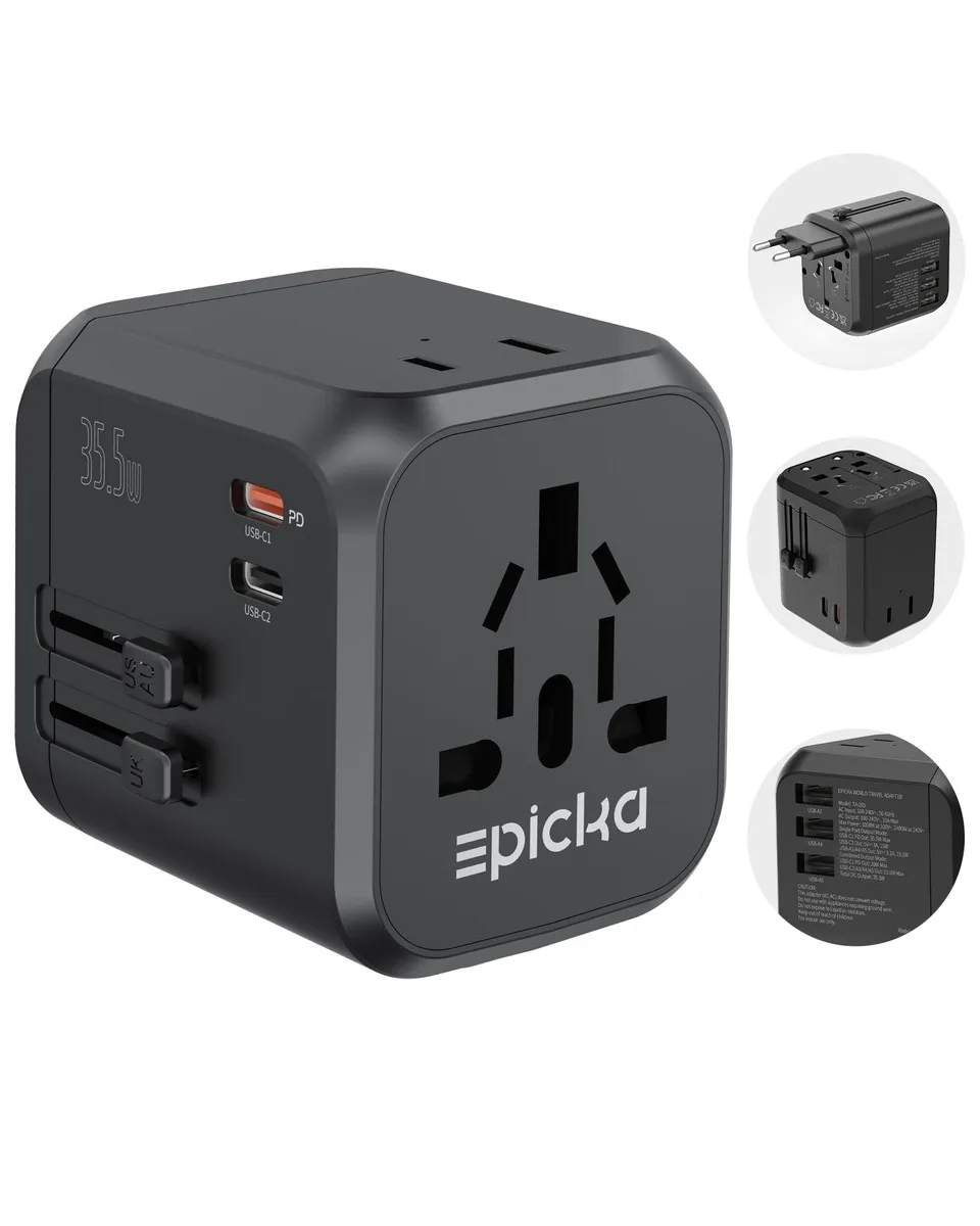 Compact black travel adapter with sliding plug modules and multiple USB ports
