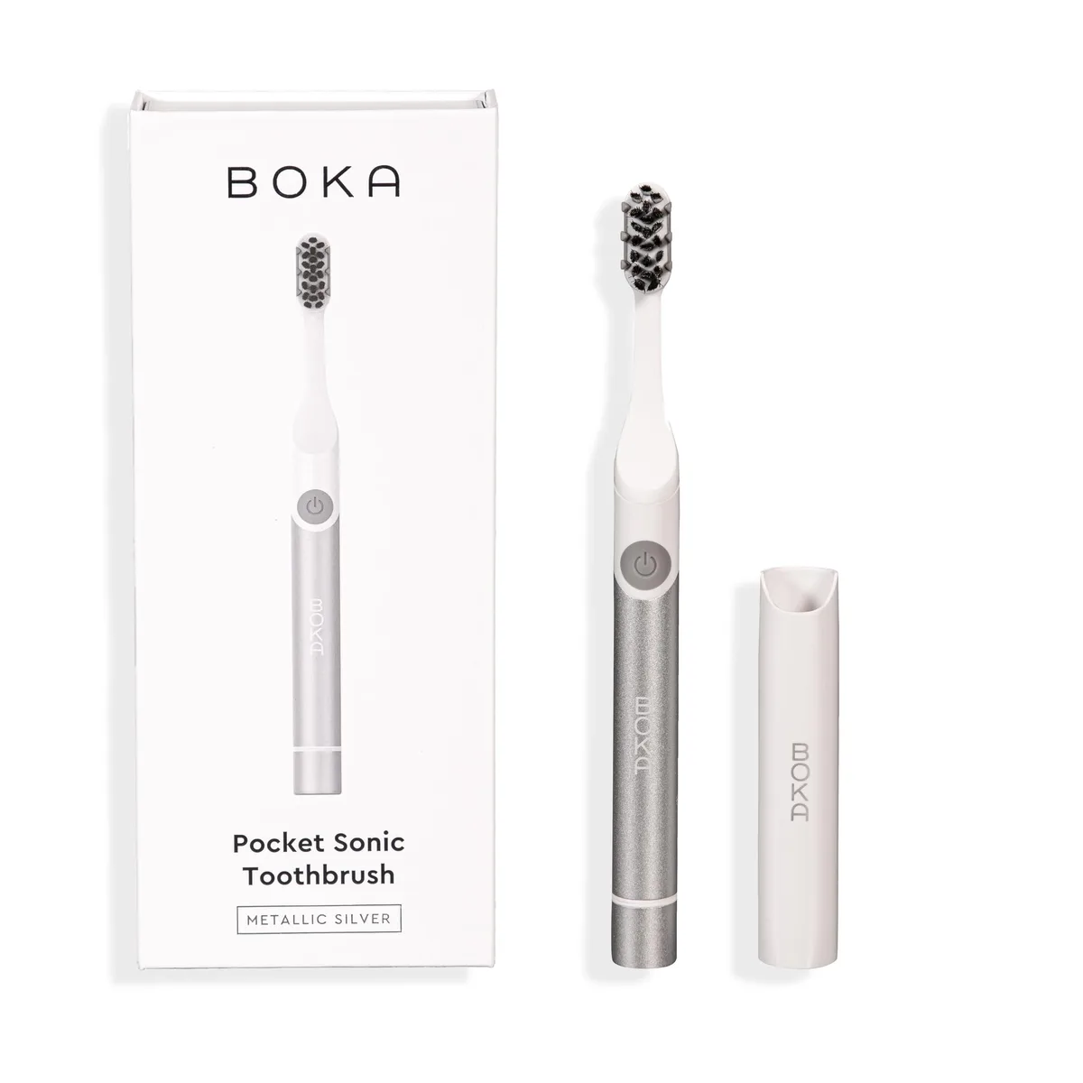 Silver sonic electric toothbrush with travel case and wall-mountable brush head cap