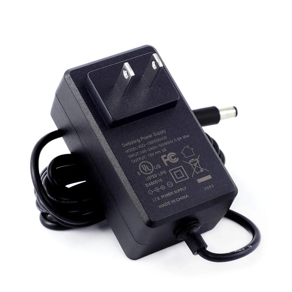 Black rectangular power adapter with US plug and detachable barrel tip converter