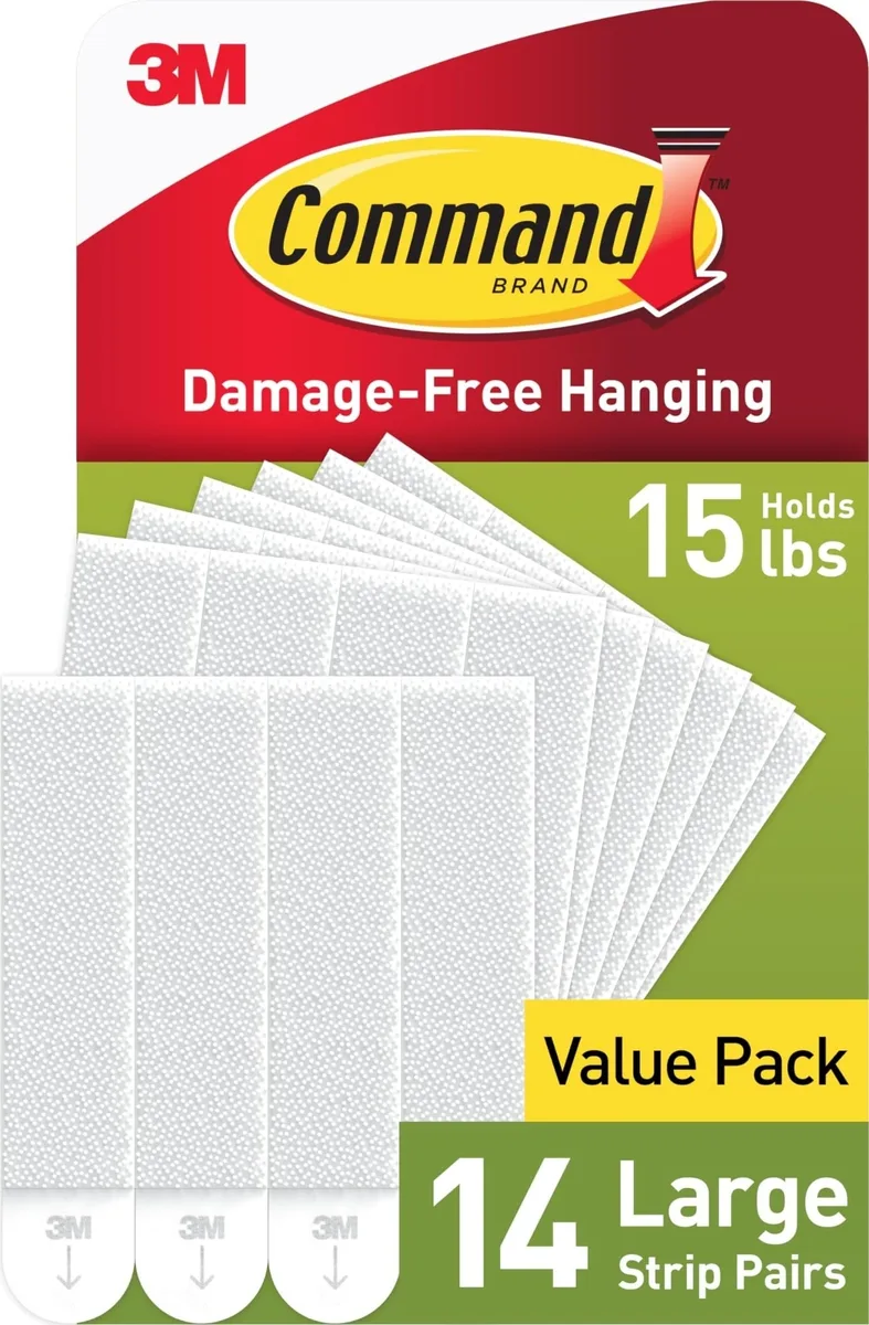 White rectangular foam adhesive strips in bulk packaging