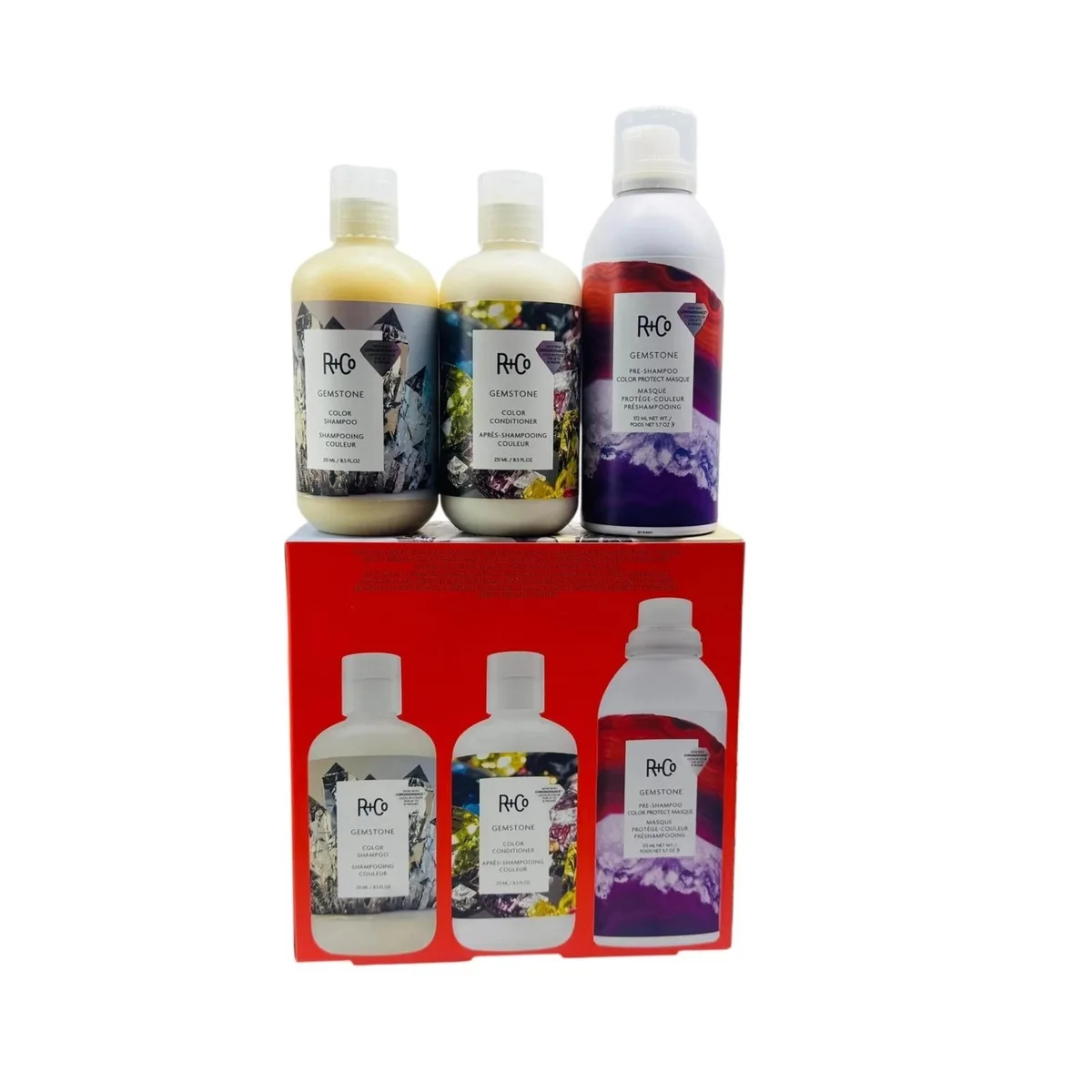 Three haircare bottles in cream, white and purple, sizes 8.5oz, 8.5oz and 5.7oz