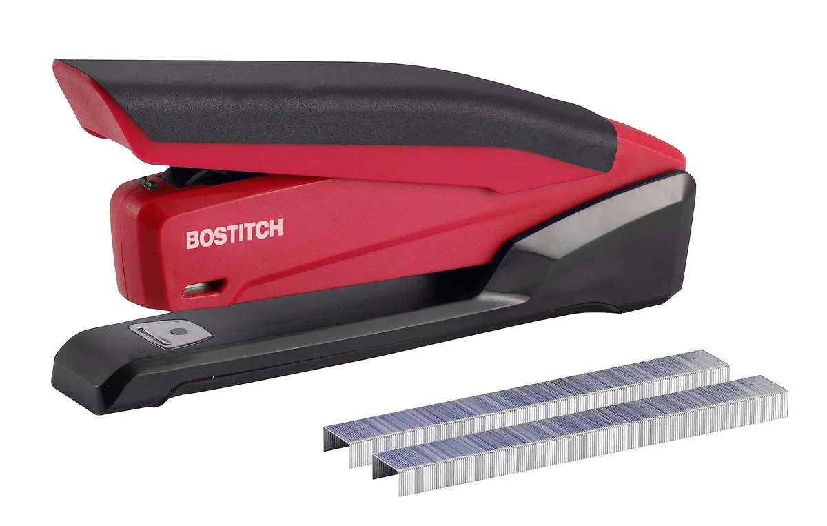 Red plastic Bostitch 1124 stapler, compact spring-powered design with integrated remover