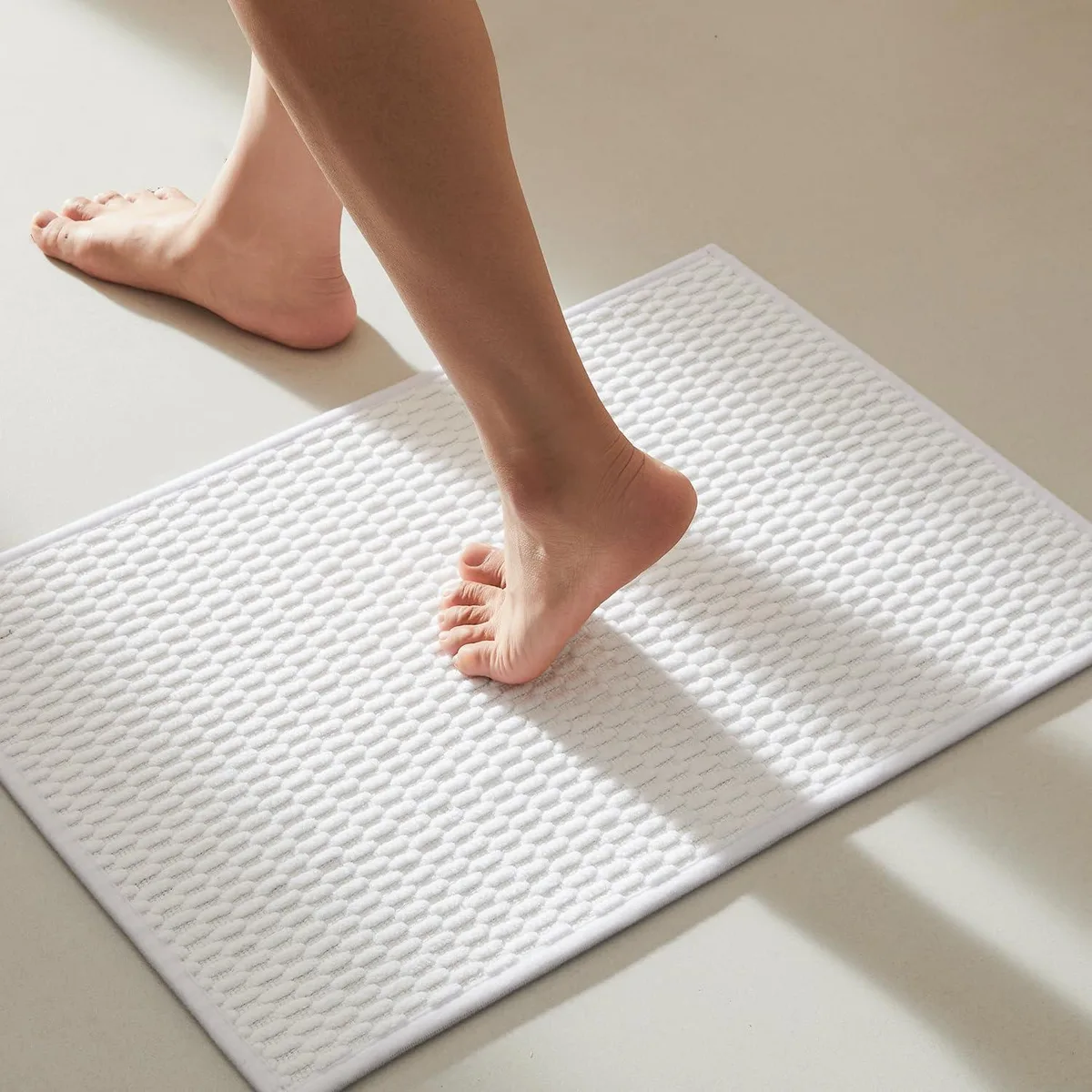 White rectangular chenille bath rug 16x24 inches with rubber backing