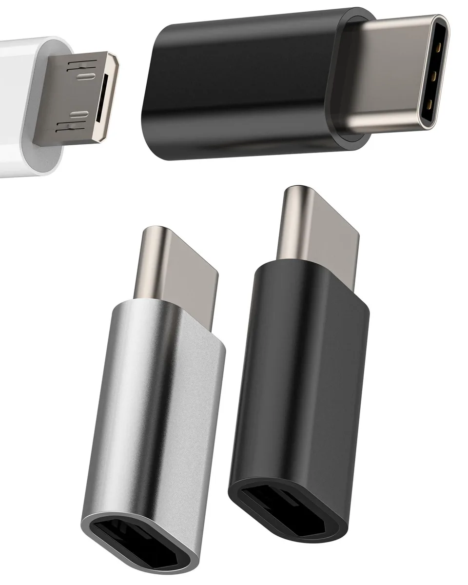 Three tiny USB-C to Micro USB adapters, two black and one silver, aluminium finish
